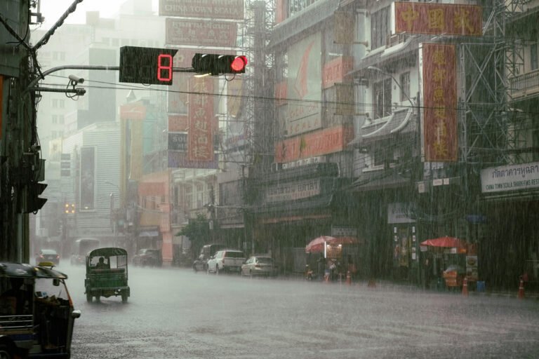 a lot of rain coming down in chinatown, bangkok