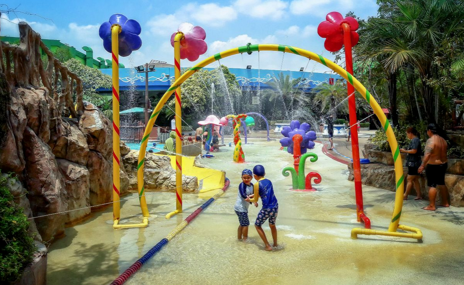 children playing in water park