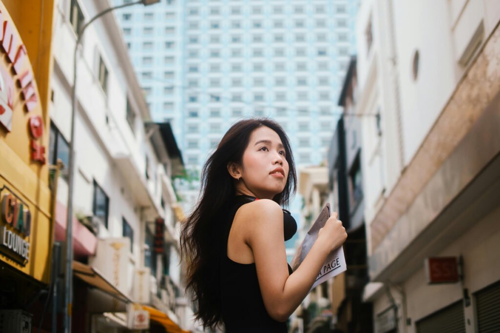 woman looking up at the city