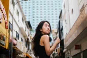 woman looking up at the city
