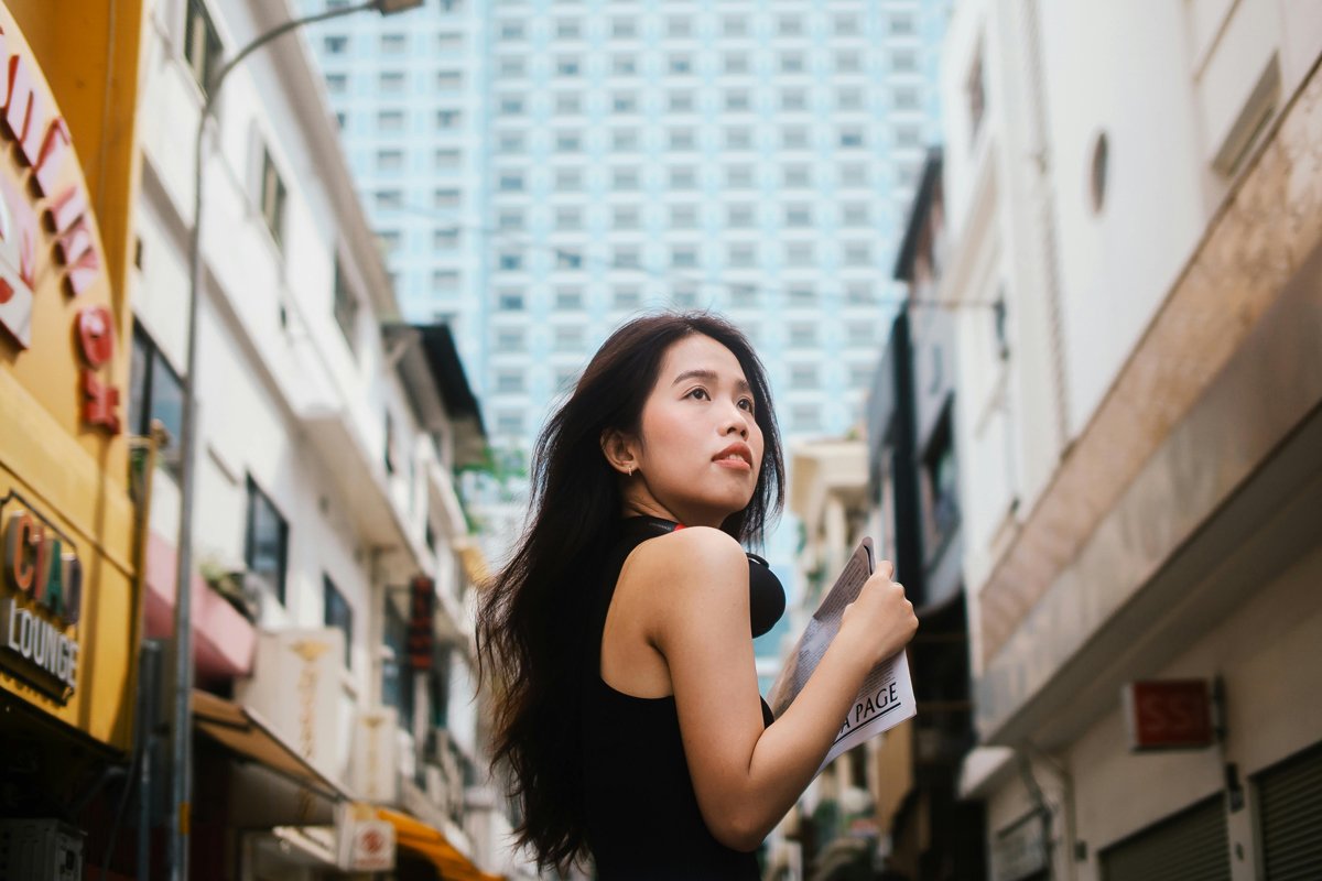 woman looking up at the city