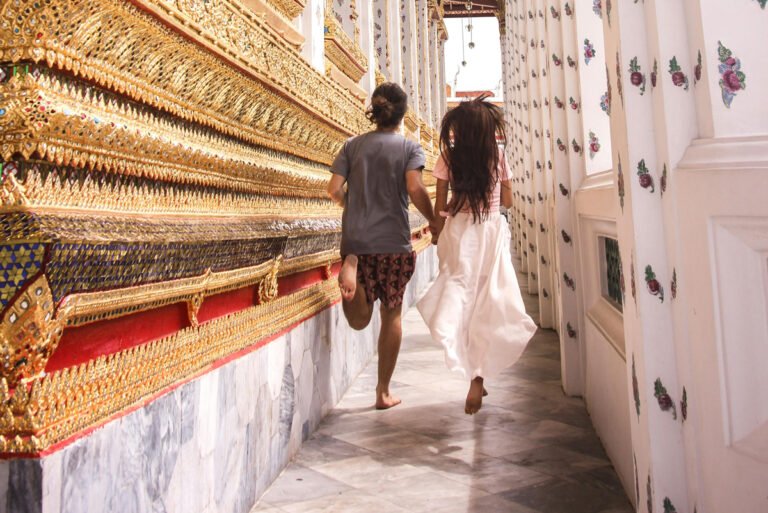 Couple running through temple on valentine's day bangkok