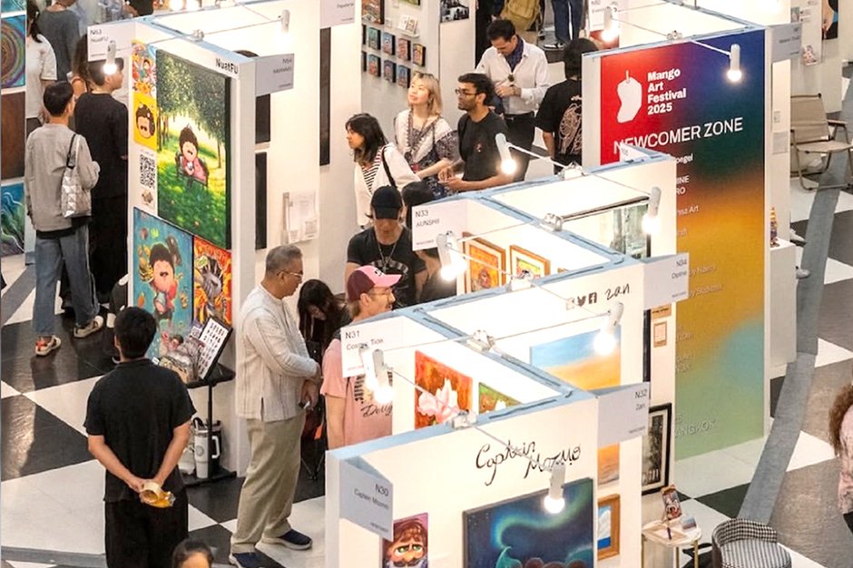 People walking around art exhibition spaces in Bangkok