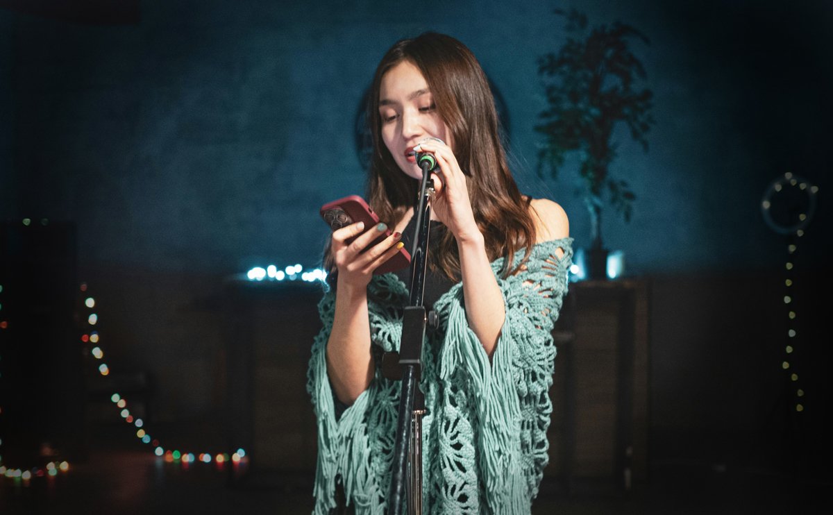 Singer standing in front of a microphone