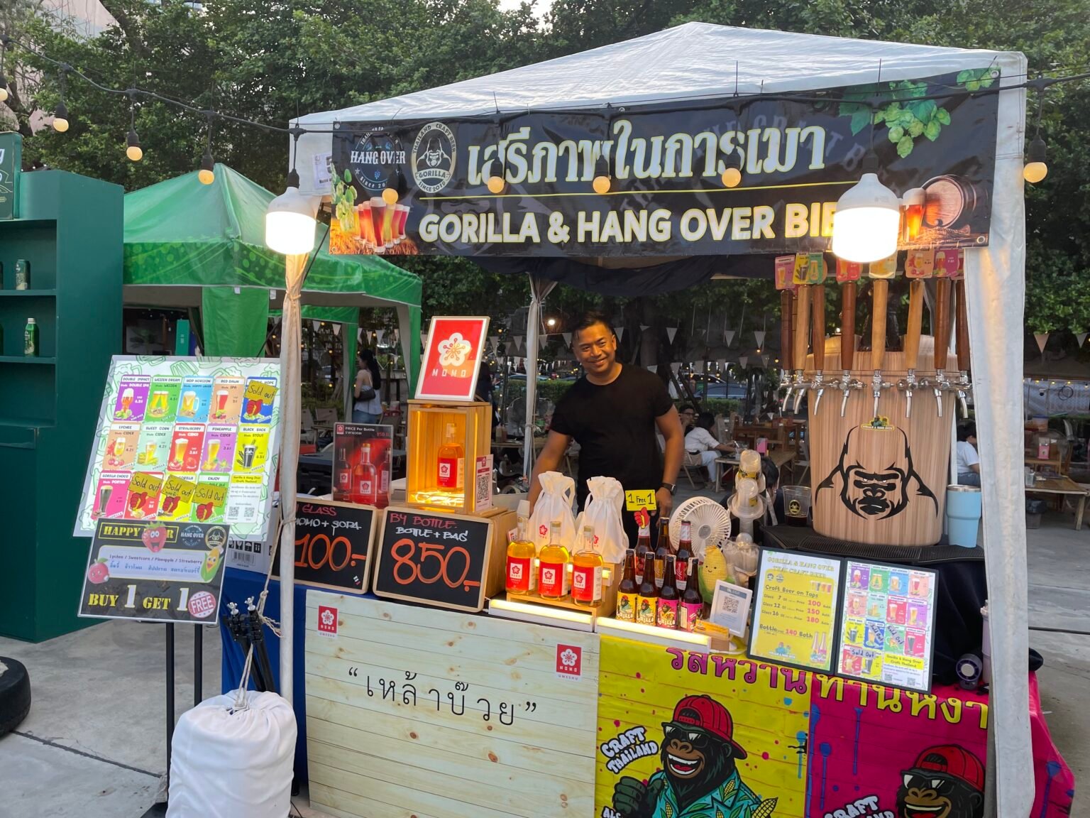 man standing in front of product booth